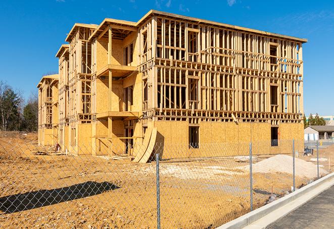 a snapshot of temporary chain link fences protecting a large construction project from unauthorized access in Arlington